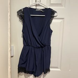 Silky romper with lace detail on shorts and sleeves